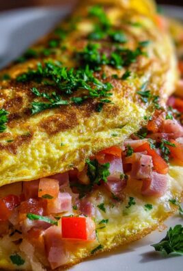 Omelette mit Putenschinken, Käse und Tomaten